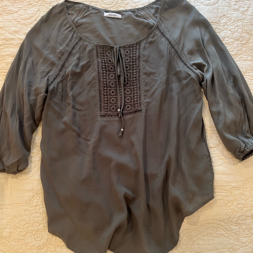 Army green, flowy and airy on. Tie up front, loose bottom to tuck or wear loose